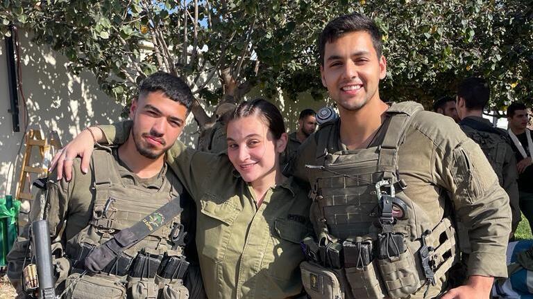 Shai Bachar, center, poses with fellow Golani Brigade soldiers before the Oct. 7 attack; Bachar later survived the siege at the Nahal Oz base, where she lost 46 friends (Photo: Belev Echad) Shai Bachar, center, poses with fellow Golani Brigade soldiers before the Oct. 7 attack; Bachar later survived the siege at the Nahal Oz base, where she lost 46 friends