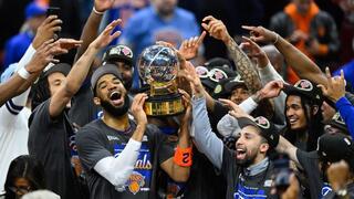 Karl-Anthony Towns hoists the Eastern Conference Championship troph