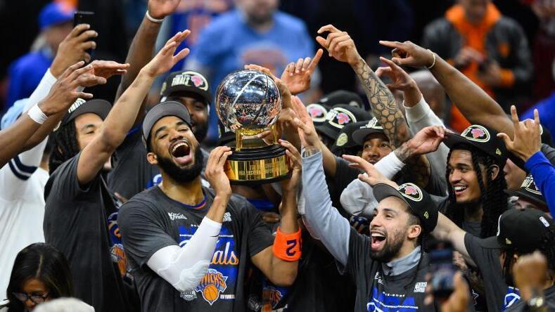 Karl-Anthony Towns hoists the Eastern Conference Championship troph