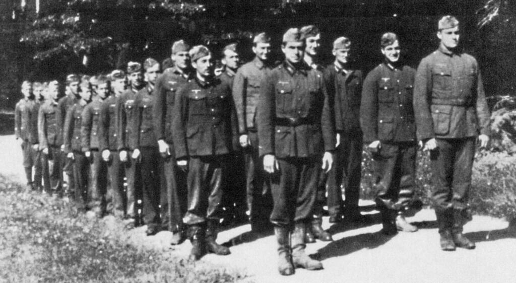 Aaron Bank standing alongside German defectors recruited for Operation Iron Cross. Bank is at left in the first rank 