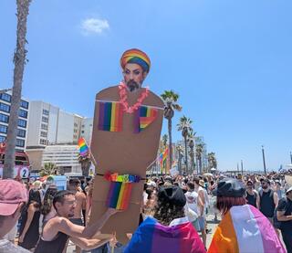 A cardboard effigy of Iranian Supreme Leader Mojtaba Khamenei, styled with makeup, at Tel Aviv’s Pride Parade 