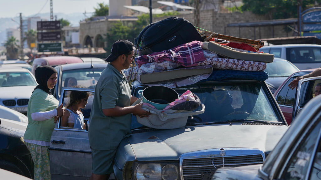 Residents of southern Lebanon (Photo: AP Photo/Mohammed Zaatari) תושבים חוזרים הביתה לדרום לבנון צידון