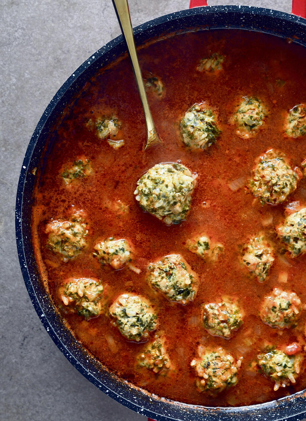 Chicken, spinach and rice meatballs in tomato sauce