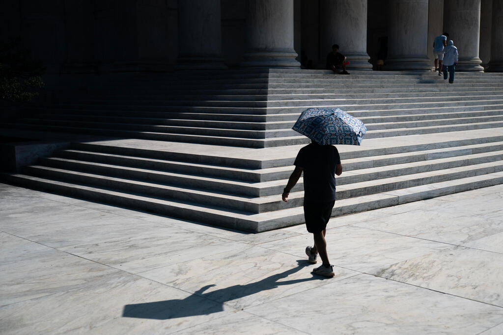 A visitor walks up the front steps of the Jefferson Memorial while carrying a sun umbrella during an extreme heat advisory, Thursday, July 2, 2026, in Washington (Photo: AP Photo/Nathan Howard) A visitor walks up the front steps of the Jefferson Memorial while carrying a sun umbrella during an extreme heat advisory, Thursday, July 2, 2026, in Washington