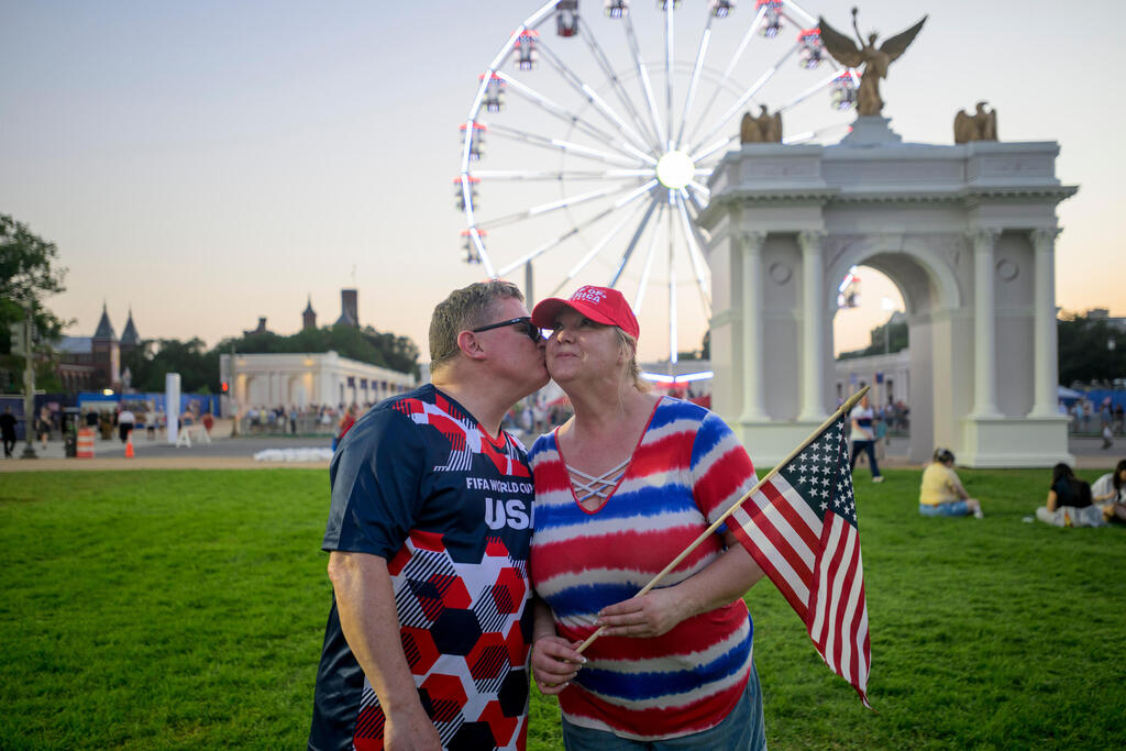 Todd Shaw, left, kisses his wife Shannon Shaw, right, as they pose for portrait during the Great American State Fair on the National Mall, Thursday, July 2, 2026, in Washington (Photo: AP Photo/Rod Lamkey, Jr.) Todd Shaw, left, kisses his wife Shannon Shaw, right, as they pose for portrait during the Great American State Fair on the National Mall, Thursday, July 2, 2026, in Washington