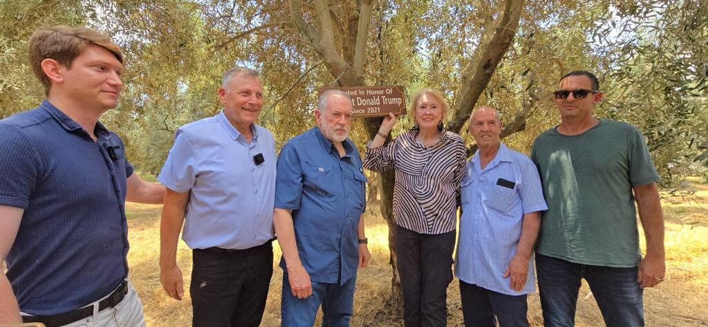 US Ambassador Mike Huckabee visits an olive tree adopted in honor of President Donald Trump at Moshav HaYogev 