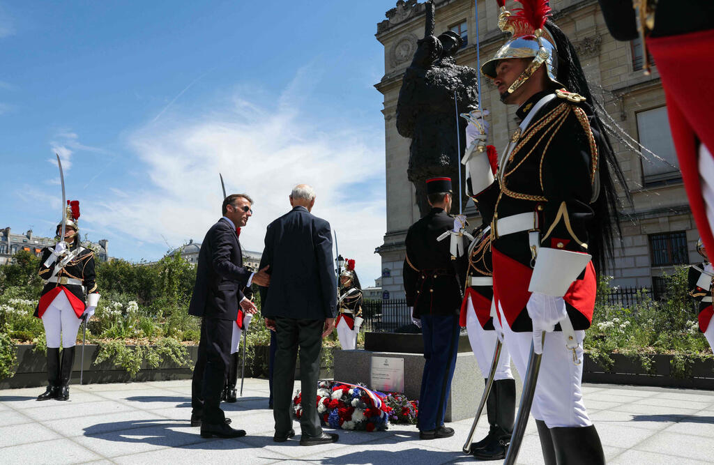 France's President Emmanuel Macron and Charles Dreyfus grandson of Alfred Dreyfus pay tribute in front of bronze statue made in 1985 by French artist Louis Mitelberg aka Tim, during a tribute ceremony to Captain Alfred Dreyfus on the first national day dedicated to the recognition of his innocence (Photo: Thomas Samson / Pool / AFP) France's President Emmanuel Macron and Charles Dreyfus grandson of Alfred Dreyfus pay tribute in front of bronze statue made in 1985 by French artist Louis Mitelberg aka Tim, during a tribute ceremony to Captain Alfred Dreyfus on the first national day dedicated to the recognition of his innocence