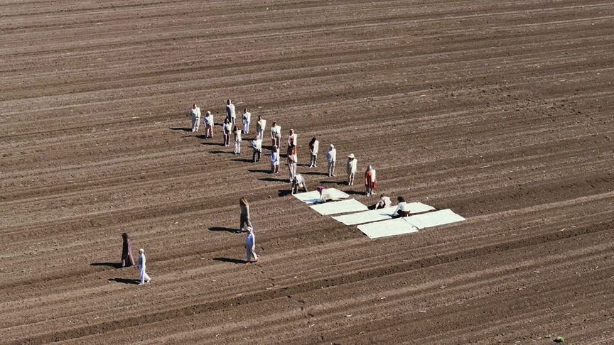 '"I created an artwork called Lullaby, showing 26 women covering a plowed field with white burial shrouds' (Photo: Avi Kagan) "שיר ערש" יצירה של יעל סרלין
