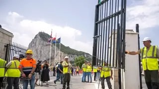 Workers remove the fence separating the disputed British overseas territory from Spain on the first day of passport-free travel under a new EU-U.K. treaty, at the border crossing between Gibraltar and Spain in La Línea de la Concepción, Spain, Wednesday, July 15, 2026 