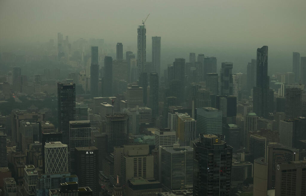 Toronto is blanketed in smoke (Photo: Cole Burston / AFP) קנדה שריפות עשן טורונטו