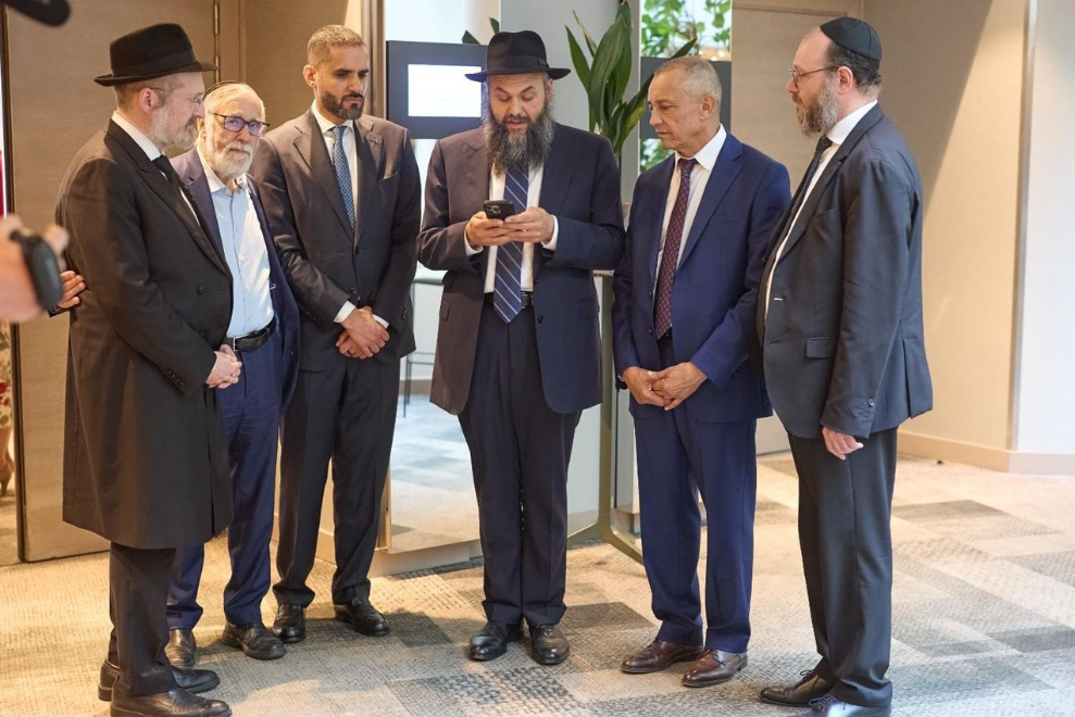 (From left): Rabbi Mendy Chitrik, Chief Rabbi Albert Guigui of Brussels, Mohamed Ismail Al Sahlawi, Rabbi Levi Banon of Casablanca, Ahmed Reda Chami; and Rabbi Levi Matusof of Paris, in Brussels, July 13, 2026 (Photo: Gabriel Lelievre) (From left):