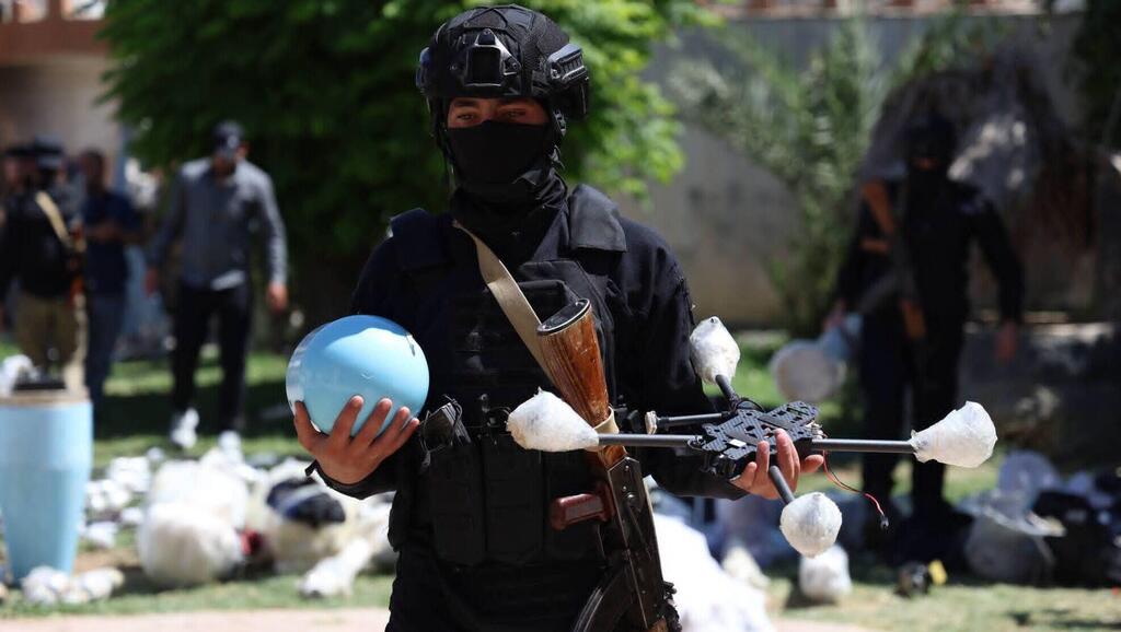 A member of Syria’s Interior Ministry holds a drone that authorities said was part of an alleged weapons shipment intercepted near the Syrian-Iraqi border, July 16, 2026 (Photo: Syrian Interior Ministry) A member of Syria’s Interior Ministry holds a drone that authorities said was part of an alleged weapons shipment intercepted near the Syrian-Iraqi border, July 16, 2026