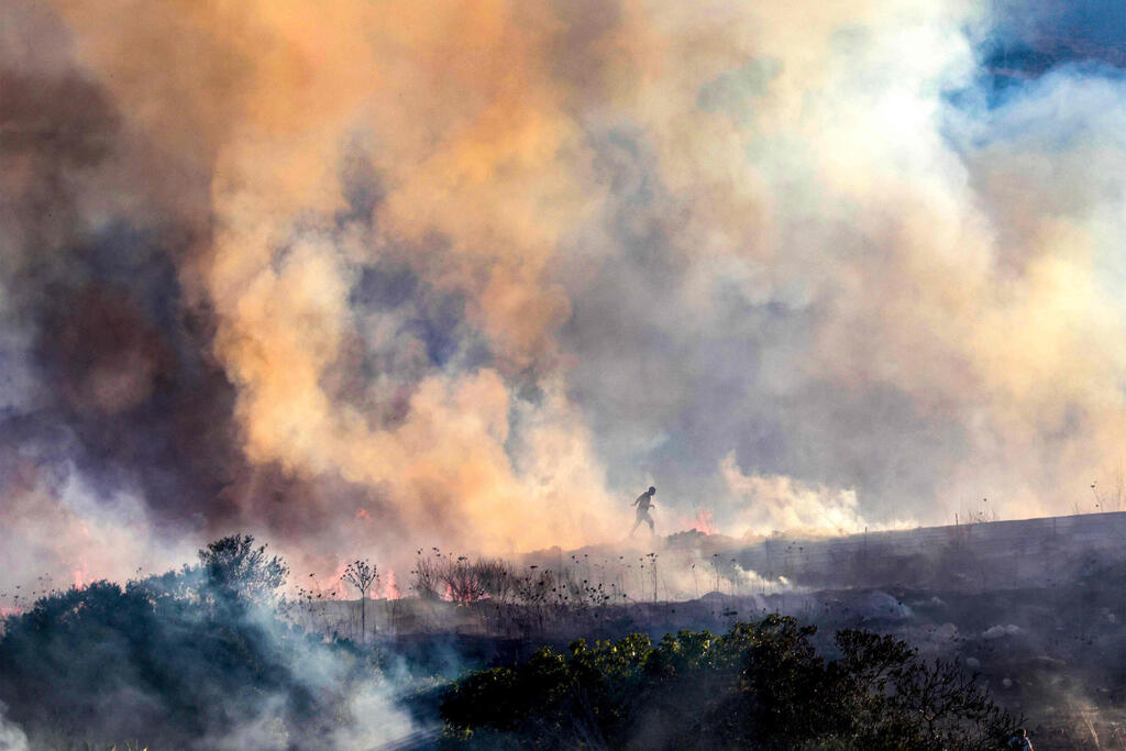 Photo: Jaafar ASHTIYEH / AFP השריפה בחוות גלעד