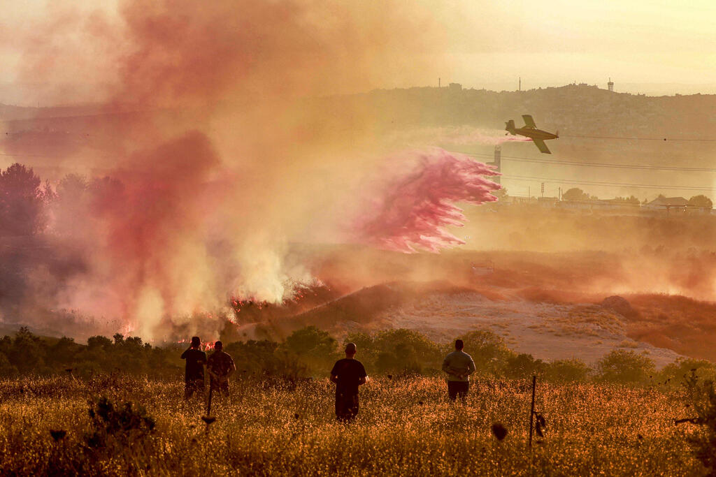 Photo: Jaafar ASHTIYEH / AFP השריפה בחוות גלעד