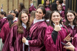 Graduates celebrate after receiving their diplomas at Beth Rivkah High School's graduation ceremony in Brooklyn, New York 