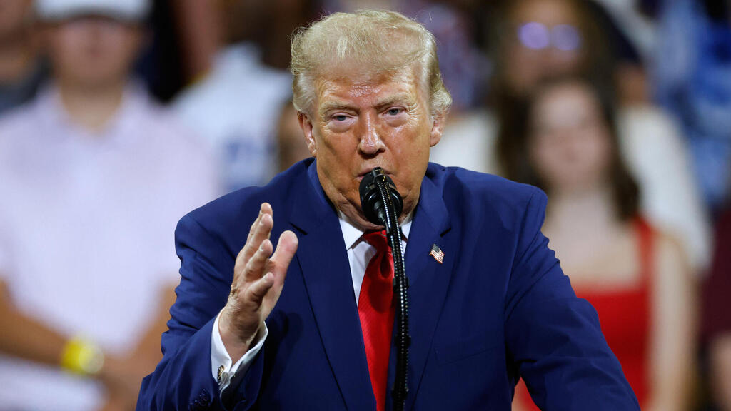US President Donald Trump told Axios that he was considering a 'massive attack, bigger than ever before' against Iran (Photo: AP Photo/Erik S. Lesser) טראמפ נואם בעצרת עם תומכיו ב תיכון ווילר ב ג'ורג'יה ארה"ב באירוע לציון תוכנית חשבונות החסכונות שלו לילדים Trump Accounts