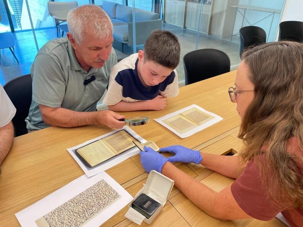 The Knobel family meeting with the miniature Bible