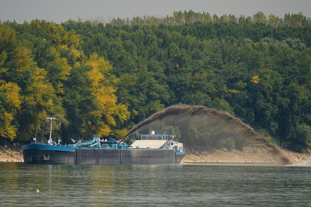 A vessel works to redirect the flow of the Danube in Romania on Monday (Photo: AP Photo/Andreea Alexandru) A vessel works to redirect the flow of the Danube in Romania on Monday