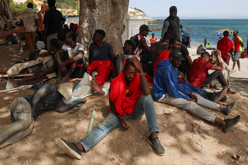 Migrants from Morocco wait on the beach in Ceuta on Monday as reception centers reach capacity (Photo: REUTERS/Violeta Santos Moura) Migrants from Morocco wait on the beach in Ceuta on Monday as reception centers reach capacity