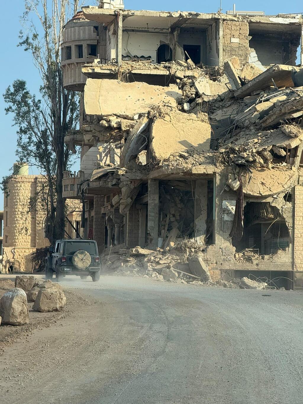 Destruction along the road to the fortress. All the villages were cleared of terrorists 