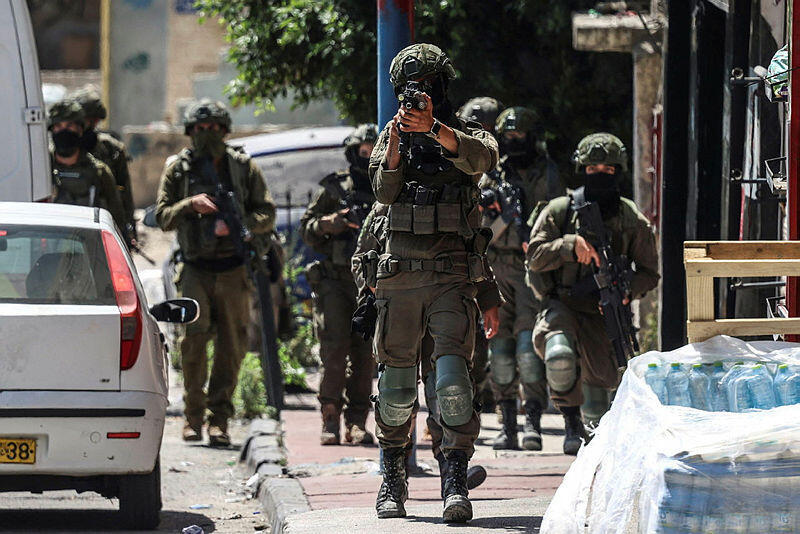 The IDF took control of the Jenin, Tulkarm and Nur Shams refugee camps (Photo: Zain JAAFAR / AFP) כוחות צה"ל בקלנדיה