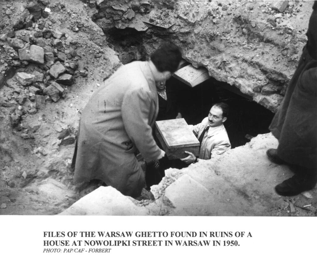 Workers recover part of the Oyneg Shabes Archive from beneath the ruins of the former Warsaw Ghetto after World War II. The clandestine collection of nearly 35,000 documents was buried by Jewish historians to preserve a firsthand account of the Holocaust (Photo: Courtesy of the Museum of Jewish Heritage – A Living Memorial to the Holocaust) Workers recover part of the Oyneg Shabes Archive from beneath the ruins of the former Warsaw Ghetto after World War II. The clandestine collection of nearly 35,000 documents was buried by Jewish historians to preserve a firsthand account of the Holocaust