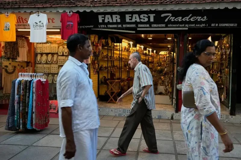 Keith Hallegua, center, walks past a handicrafts store toward the 458-year-old Paradesi Synagogue in the historic Jew Town neighborhood (Photo: AP Photo/Aijaz Rahi) Keith Hallegua, center, walks past a handicrafts store toward the 458-year-old Paradesi Synagogue in the historic Jew Town neighborhood