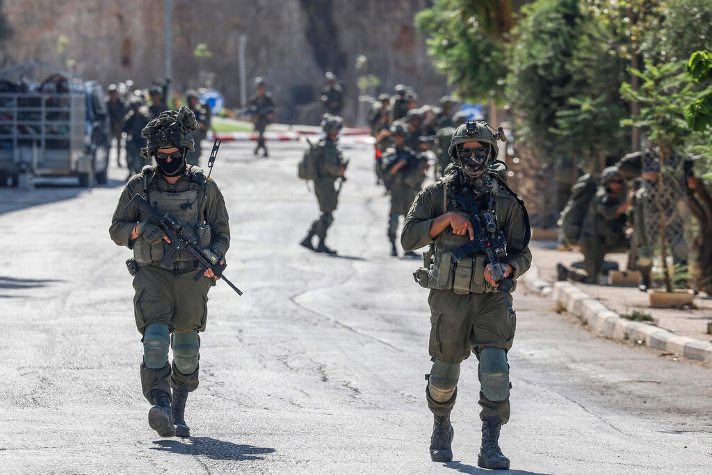 IDF troops in Qusra (Photo: Zain JAAFAR / AFP) כפר קוסרה