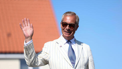 Nigel Farage. I am damned if I am going to stand on a stage, having won a resounding victory 