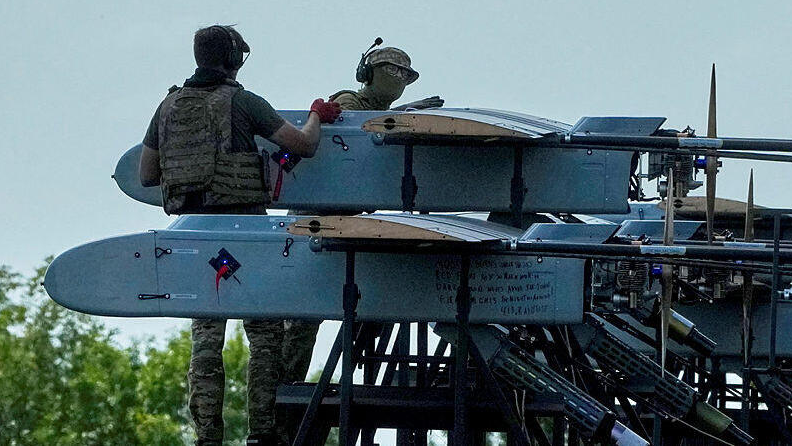 Ukrainian soldiers prepare drones for launch toward Russia 
