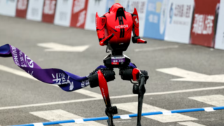 A Lightning humanoid robot by Honor crosses the finish line of the second Beijing E-Town Half Marathon and Humanoid Robot Half Marathon in Beijing 