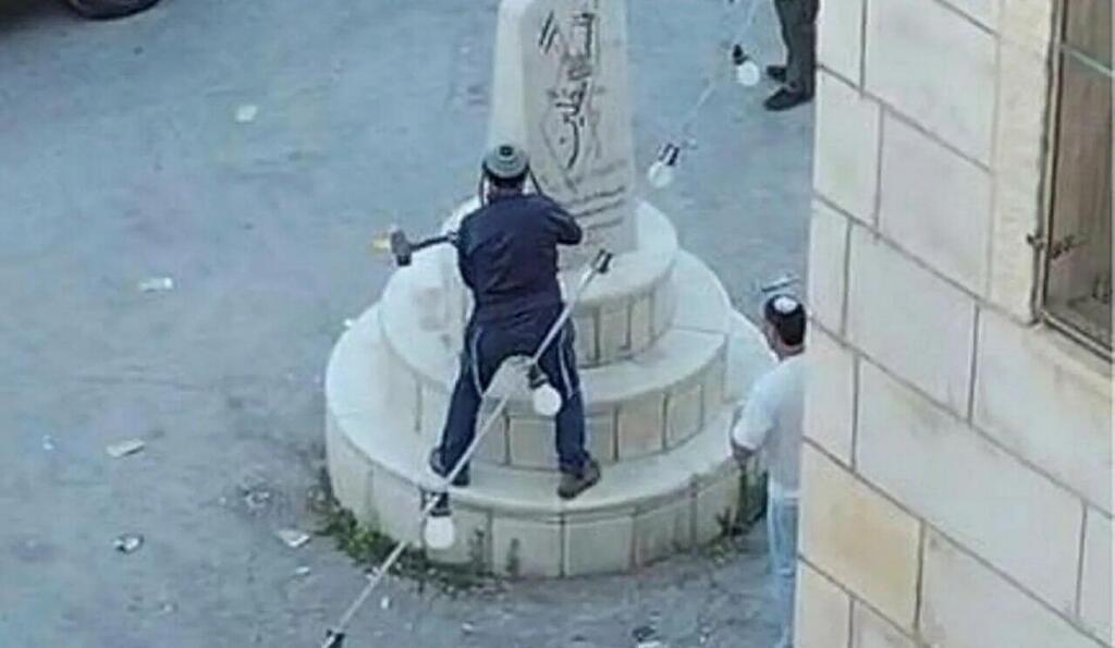 Settlers and MK Zvi Sukkot vandalize a memorial to Palestinian 'martyrs' in the village of Madama, south of Nablus מתנחלים יחד עם ח"כ צבי סוכות משחיתים אנדרטה לזכר השהידים בכפר מאדמה בדרום לשכם