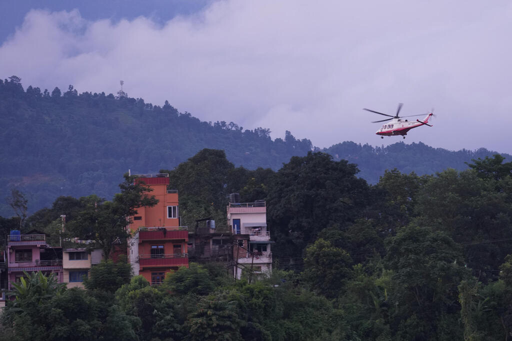 Helicopters struggle to land (Photo: Rajesh Kumar Singh/AP) Helicopters struggle to land