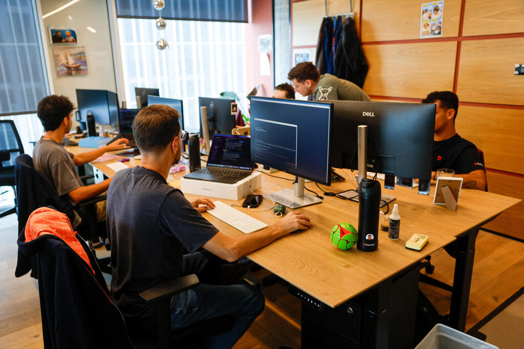 Workers at Israeli startup Gambit Security sit at their desks at the company's offices in Tel Aviv (Photo: Amir Cohen/Reuters) Workers at Israeli startup Gambit Security sit at their desks at the company's offices in Tel Aviv