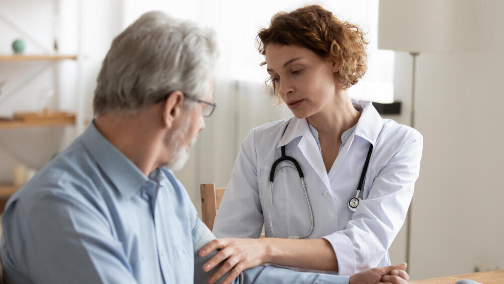 Don't force the issue or get into a confrontation — instead, ask them to get checked to determine whether there is a problem (Photo: Shutterstock) רופאה בודקת מטופל מבוגר