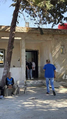 Najm and patients waiting at the local clinic established with IDF assistance to treat the wounded  