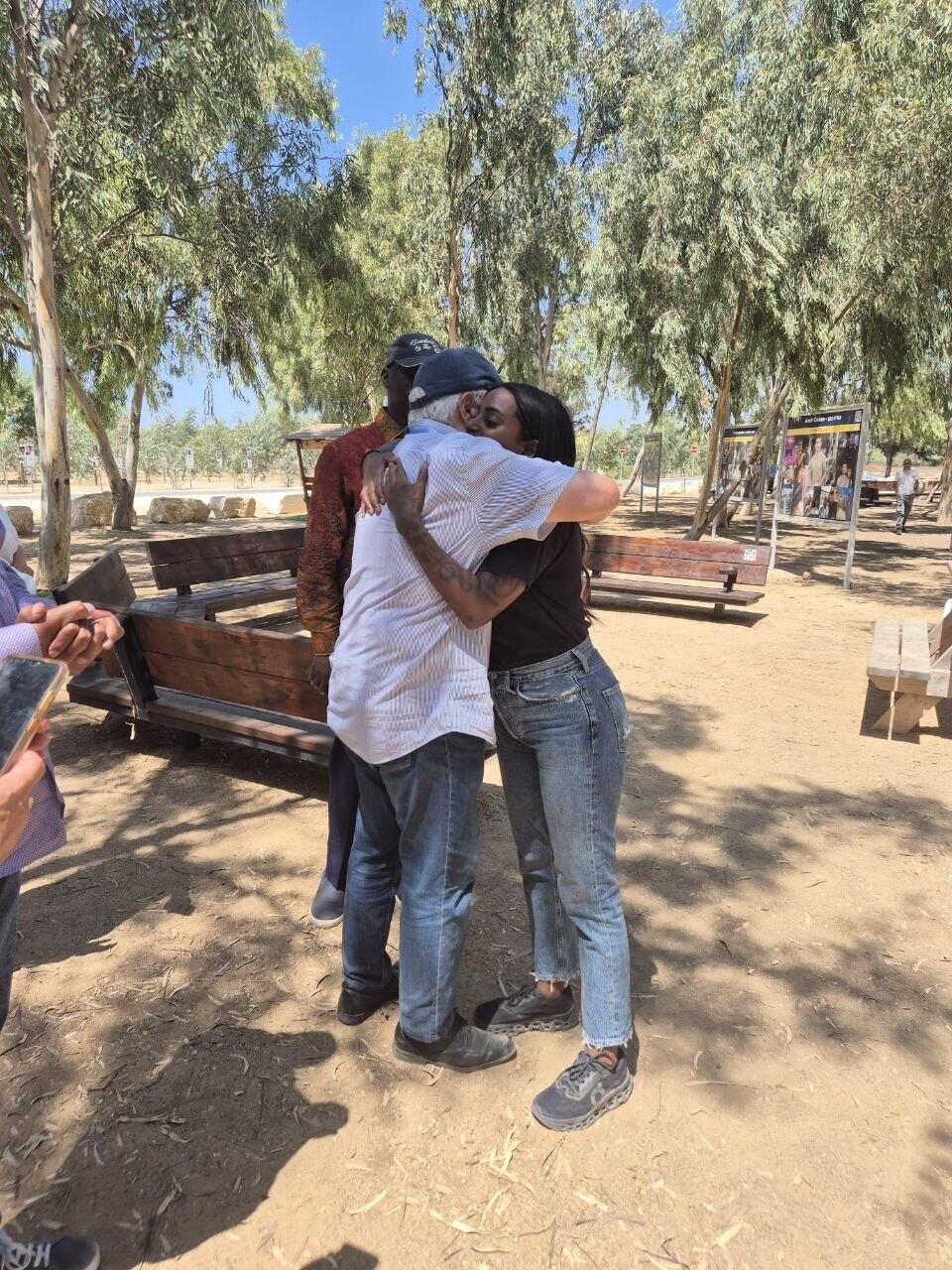 U.N. ambassadors embrace Sarah, a survivor of the Oct. 7 massacre, during a visit to the Nova memorial site (Photo: Ministry of Foreign Affairs) משלחת שגרירי האו"ם באתר הנובה, מתחבקים עם ניצולה