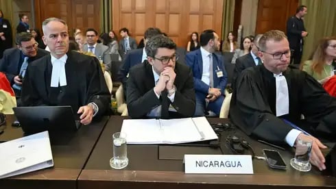 Members of the legal delegation representing Nicaragua, including counsel and advocate Daniel Mueller, right, attend public hearings on the preliminary objections raised by Germany in the case brought by Nicaragua at the International Court of Justice (ICJ) at the Peace Palace in The Hague, Netherlands 