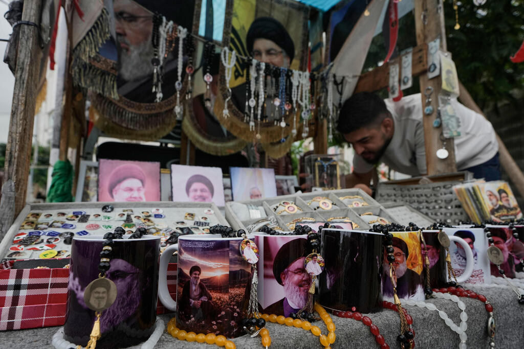 Souvenirs bearing images of Hassan Nasrallah are displayed for sale in Beirut (Photo: AP Photo/Bilal Hussein) ביירות