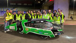 AFEKA Racing team members pose with an Israeli flag at the iLumen European Solar Challenge in Belgium 