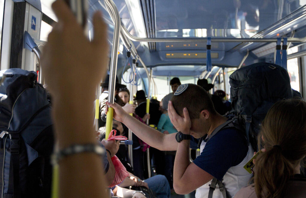 Passengers on a crowded bus 