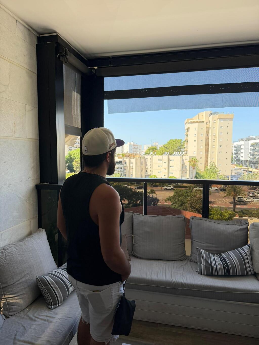 Amir on the balcony of his home: Tech for Heroes solutions enabled him to reconnect with family life (Photo: Courtesy of Amir) Amir on the balcony of his home: Tech for Heroes solutions enabled him to reconnect with family life