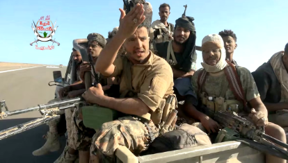 Pro-Saudi-backed Yemeni government fighters sit in the back of a vehicle during what government forces say was an advance against the Iran-backed Houthis, near Dhubab, Taiz Governorate, Yemen, in this still image taken from video released October 5, 2026 