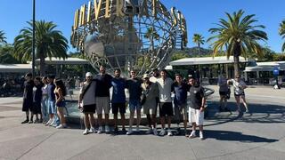 Eight wounded IDF soldiers pose outside Universal Studios Hollywood during an eight-day Los Angeles retreat organized by Belev Echad, offering respite from rehabilitation and the lingering effects of war 