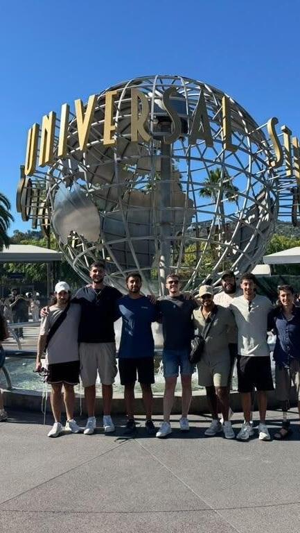 Eight wounded IDF soldiers pose outside Universal Studios Hollywood during an eight-day Los Angeles retreat organized by Belev Echad, offering respite from rehabilitation and the lingering effects of war 
