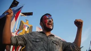 A supporter of the Southern Transitional Council (STC) holds a South Yemen flag during a rally to celebrate the 63rd anniversary of the October 14 Revolution against British colonial rule and respond to calls for mobilization against the Houthi rebels in Aden, Yemen, Wednesday, Oct. 14, 2026 