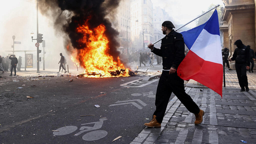 Photo: REUTERS/Jack Taylor צרפת פריז מהומות 17 אוקטובר