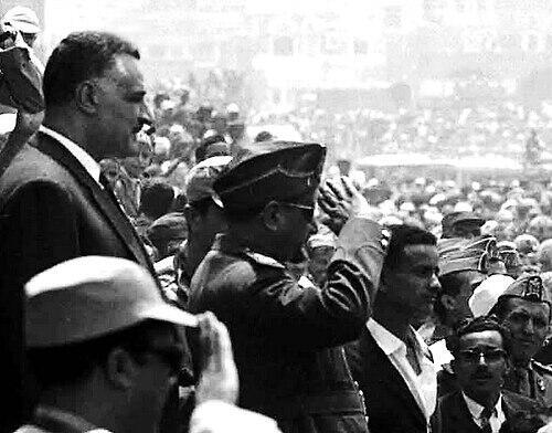 Egyptian President Gamal Abdel Nasser (standing to the left) welcomed by Yemeni crowds on his visit to Sanaa, April 1964. In front of Nasser is Yemeni President al-Sallal, saluting 