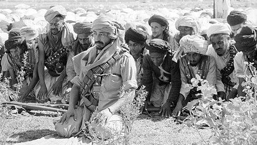Muhammad al-Badr praying with his guards 