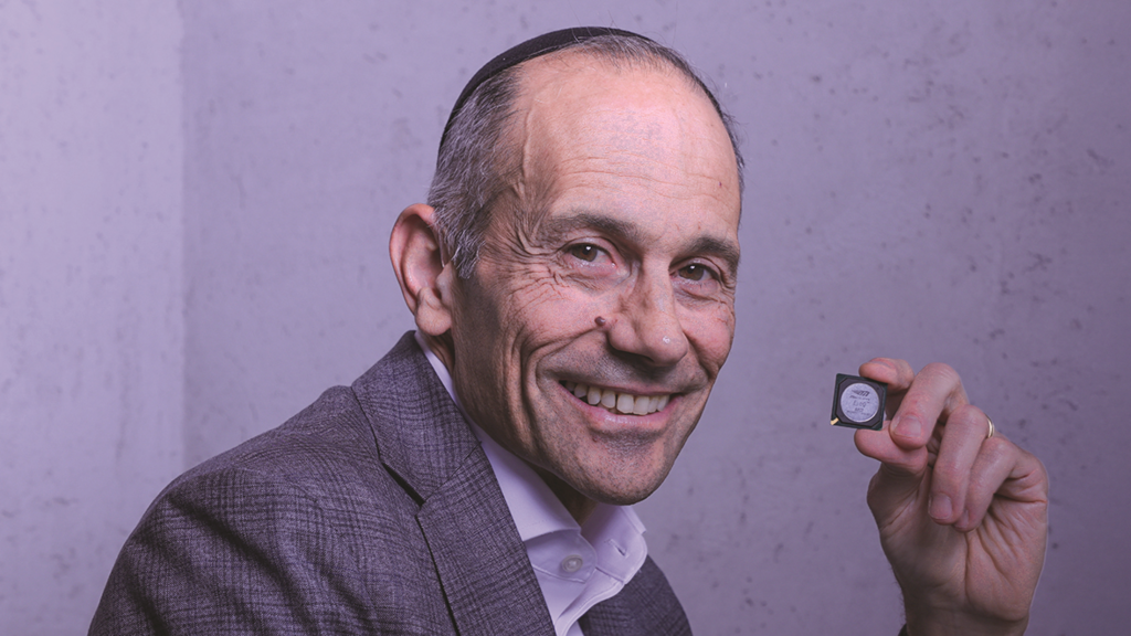 Rabbi Dr. Mois Navon with the chip he helped develop at Mobileye (Photo: Ryan Froiss) Rabbi Dr. Mois Navon with the chip he helped develop at Mobileye